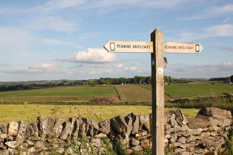 A wooden signpost with 'pennine bridleway' written on it